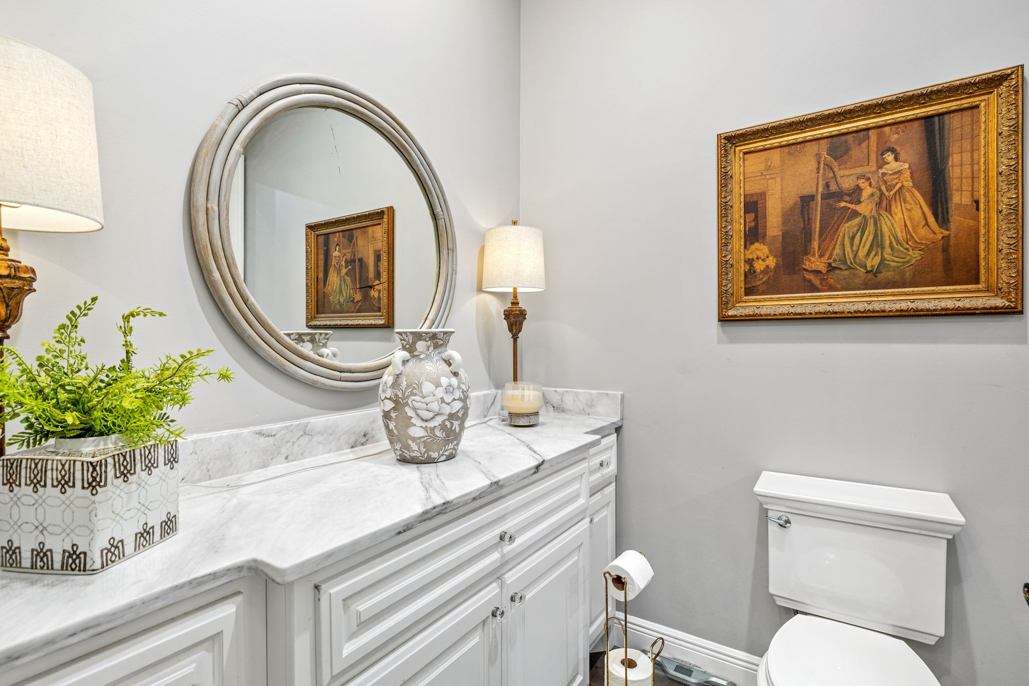 74 Pine Lake Road Summertown, TN 38483 - Photo 35 of 90 a bathroom with a toilet a sink and a mirror