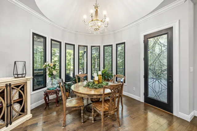 a view of a lake with houses in the back