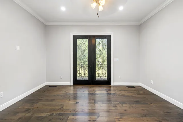 a front view of a house with a garden