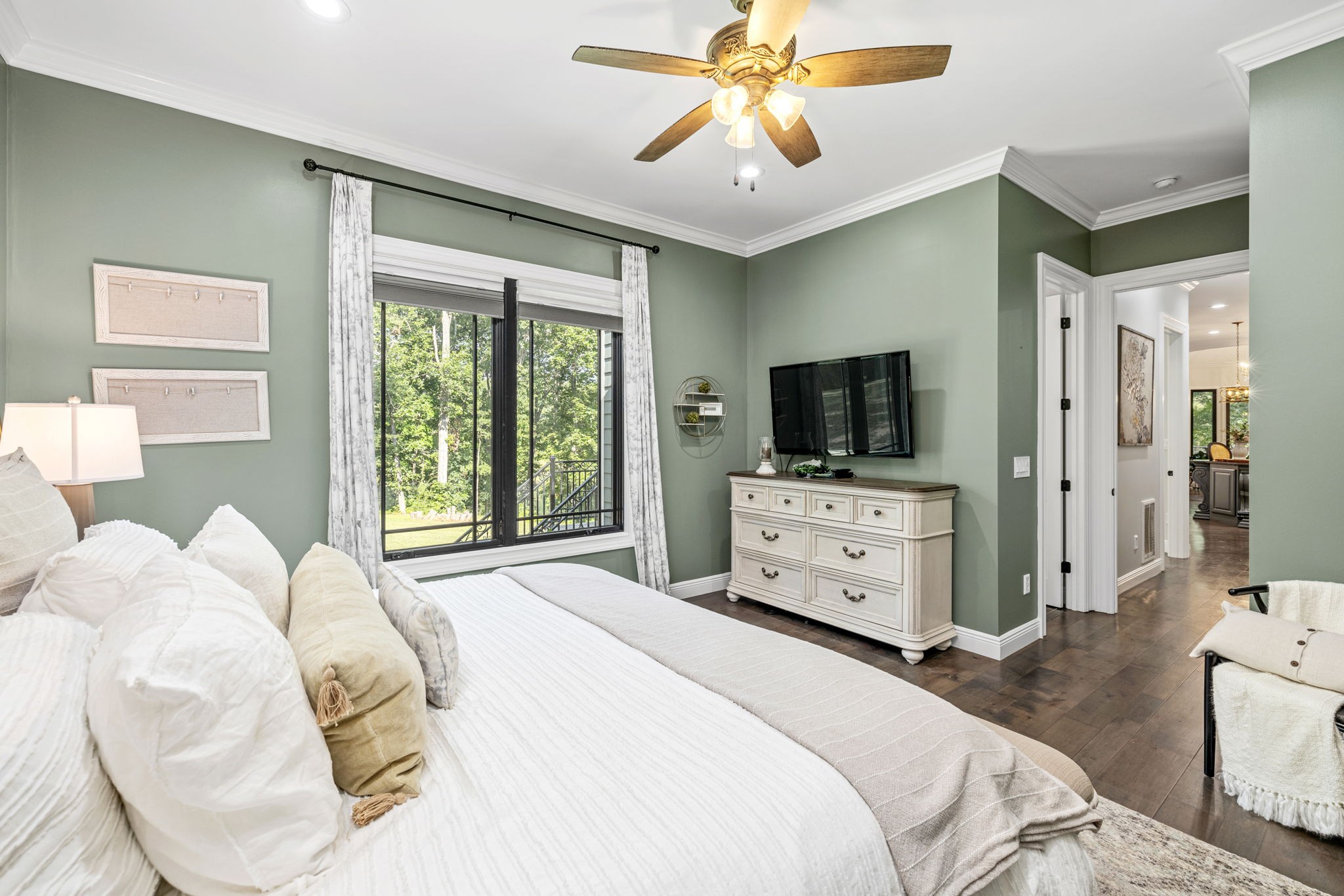 74 Pine Lake Road Summertown, TN 38483 - Photo 52 of 90 a bedroom with a large bed and a flat tv screen on dresser