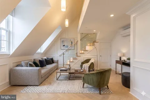 a living room with furniture and a couch