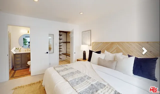 a bed room with a bed and a couch