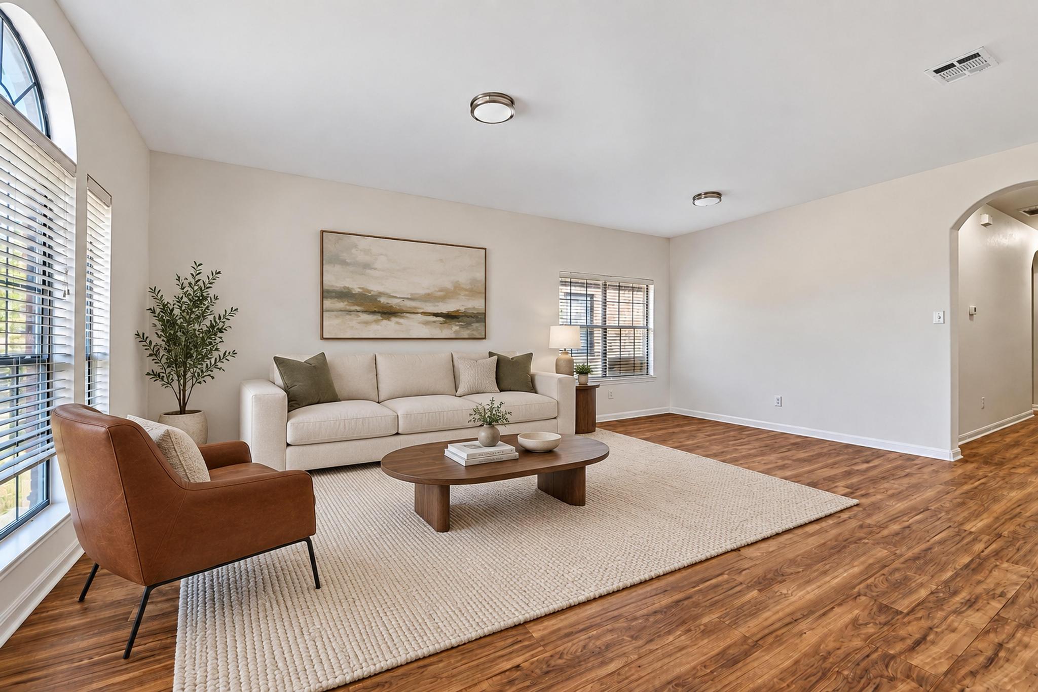 150 Engineers Pass Jarrell, TX 76537 - Photo 5 of 40 Gleaming hardwood floors and classic arched doorways anchor this inviting living space.