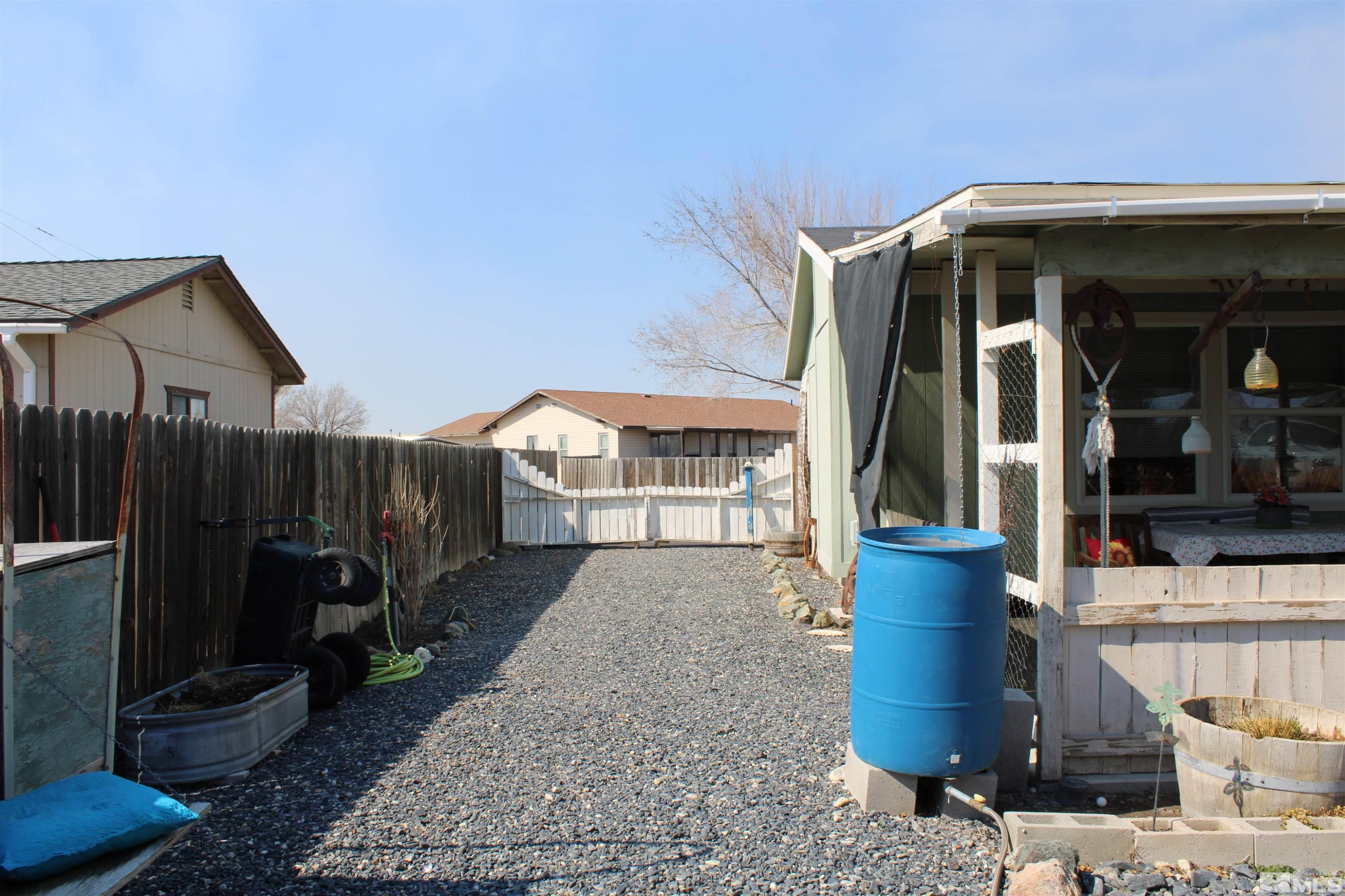 290 Reservoir Road Lovelock, NV 89419 - Photo 10 of 15 a view of a house with backyard and sitting area
