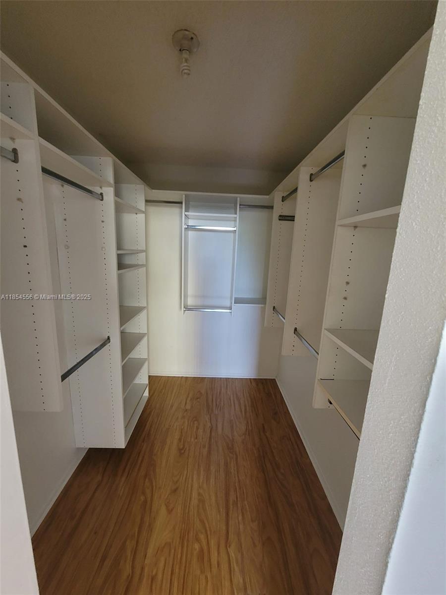 16400 Northeast 17th Avenue, Unit 206 North Miami Beach, FL 33162 - Photo 10 of 12 a view of wooden floor in an empty room