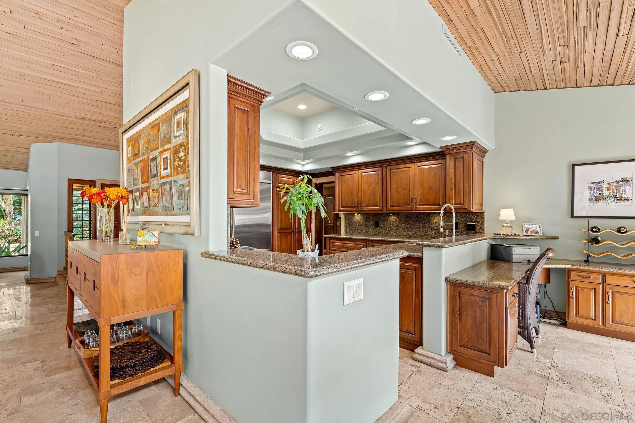 2969 Racetrack View Drive Del Mar, CA 92014 - Photo 18 of 59 a kitchen with stainless steel appliances kitchen island granite countertop a sink and cabinets