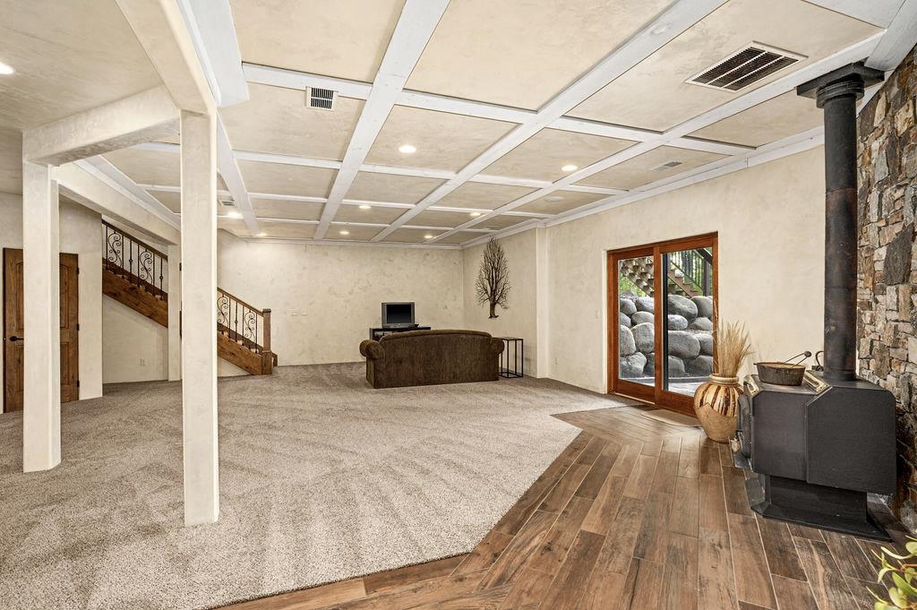 3993 Scenic View Road Moose Lake, MN 55767 - Photo 23 of 41 Lower level with open recreation room space and wood fireplace