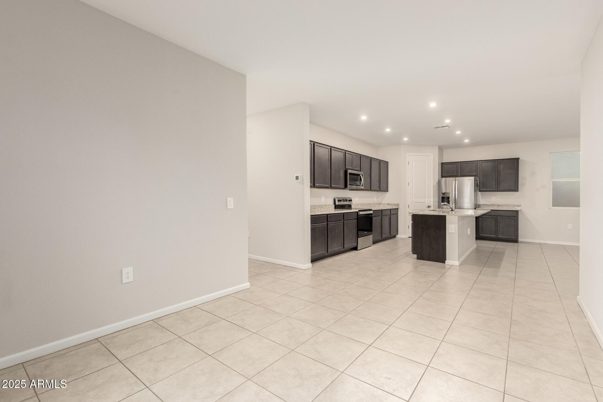 4677 South Siphon Draw Road Apache Junction, AZ 85119 - Photo 9 of 45 a view of kitchen with stove top oven and cabinets
