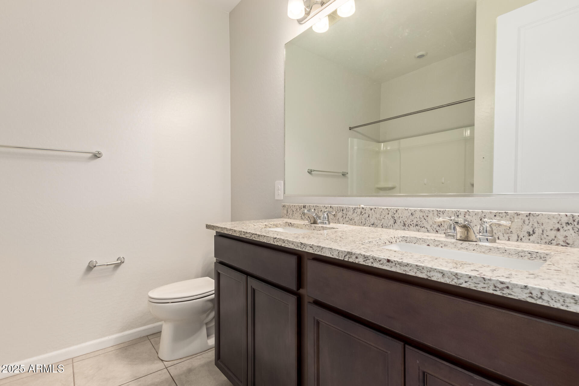 4677 South Siphon Draw Road Apache Junction, AZ 85119 - Photo 27 of 45 a bathroom with a granite countertop sink a toilet and a mirror
