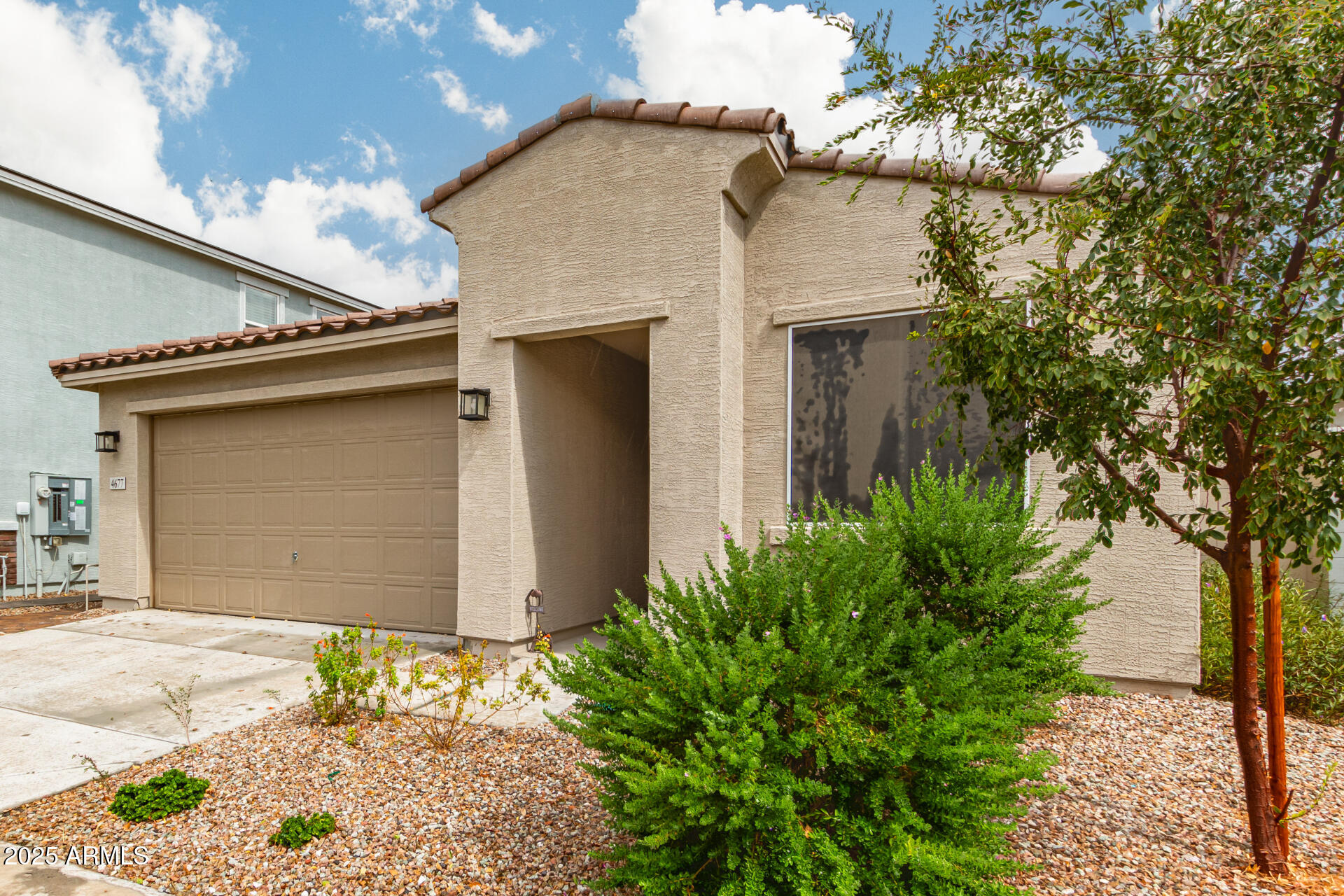 4677 South Siphon Draw Road Apache Junction, AZ 85119 - Photo 6 of 45 a front view of a house with a yard and garage