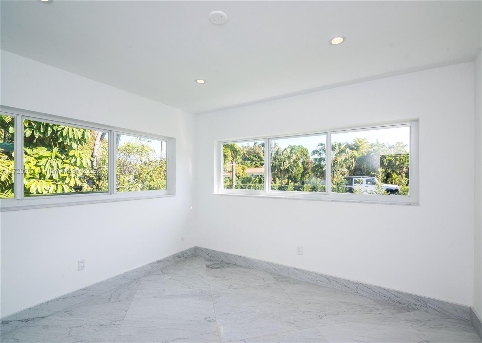 4500 Alton Road Miami Beach, FL 33140 - Photo 15 of 32 an empty room with a window