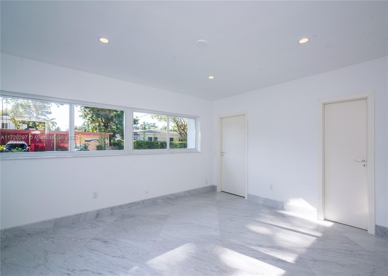 4500 Alton Road Miami Beach, FL 33140 - Photo 23 of 32 a view of an empty room with a window