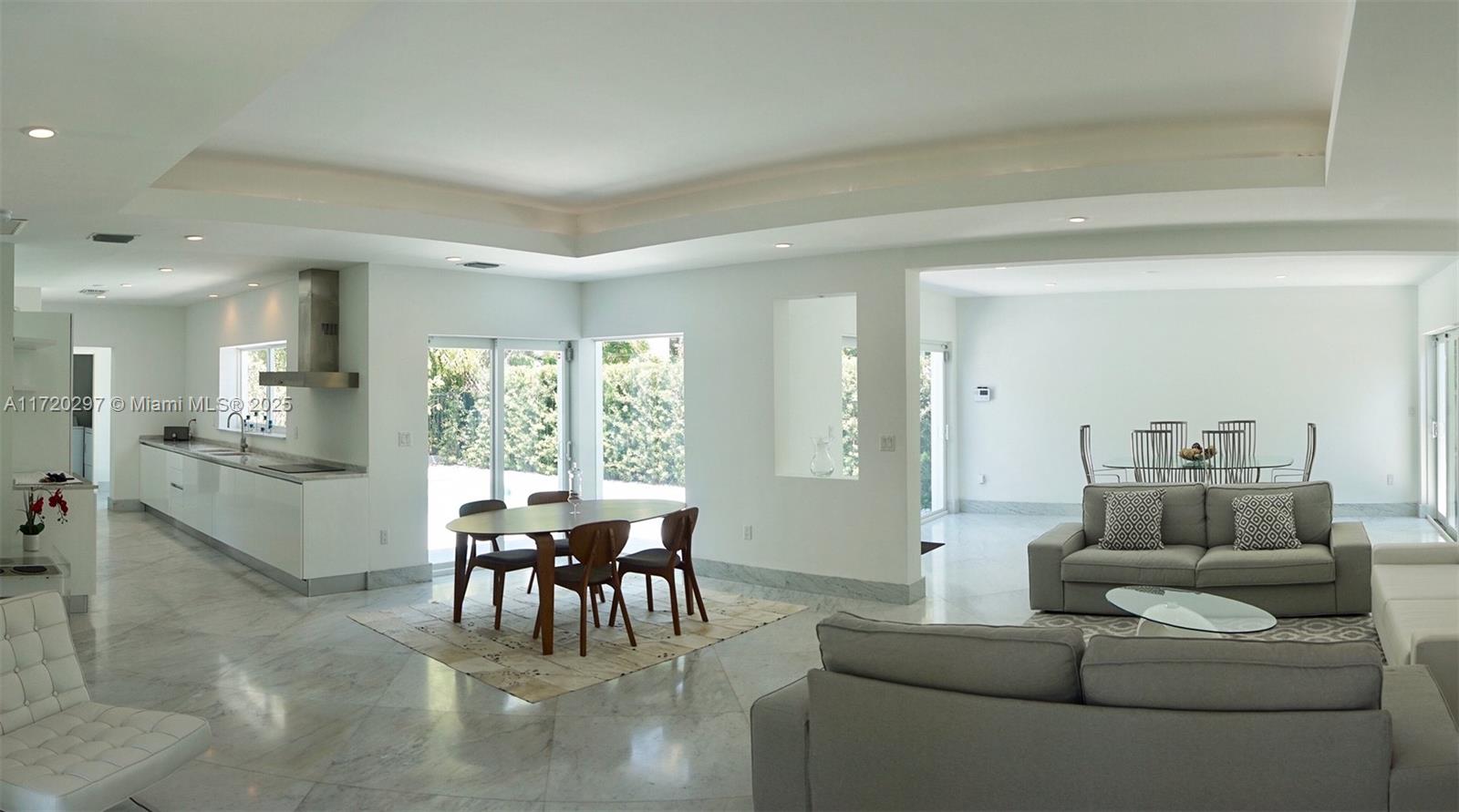 4500 Alton Road Miami Beach, FL 33140 - Photo 24 of 32 a living room with furniture and a large window