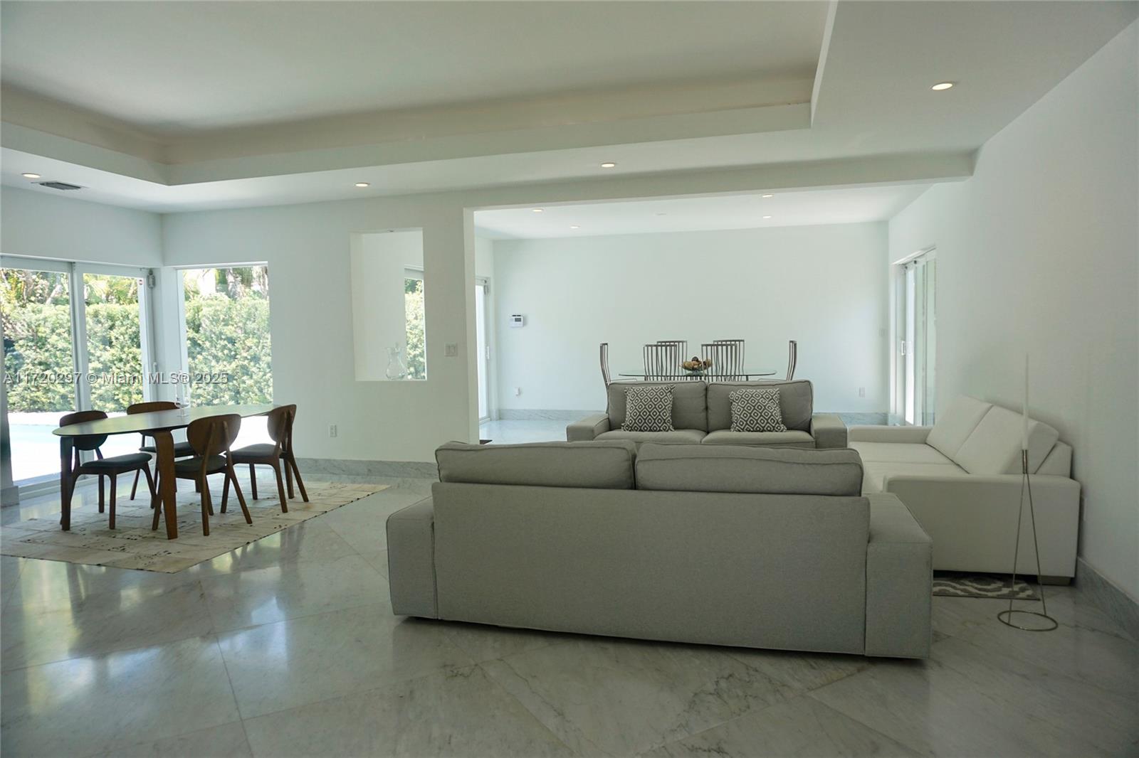 4500 Alton Road Miami Beach, FL 33140 - Photo 25 of 32 a living room with furniture and a large window