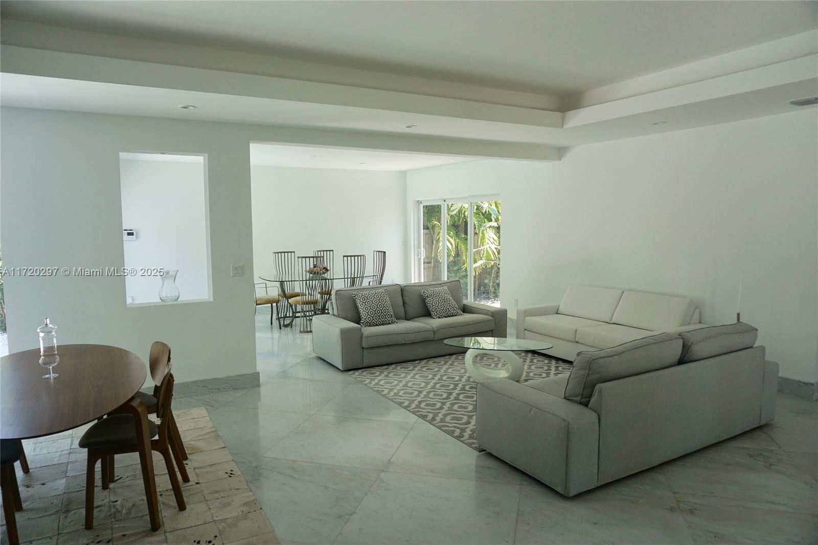 4500 Alton Road Miami Beach, FL 33140 - Photo 26 of 32 a living room with furniture and a potted plant