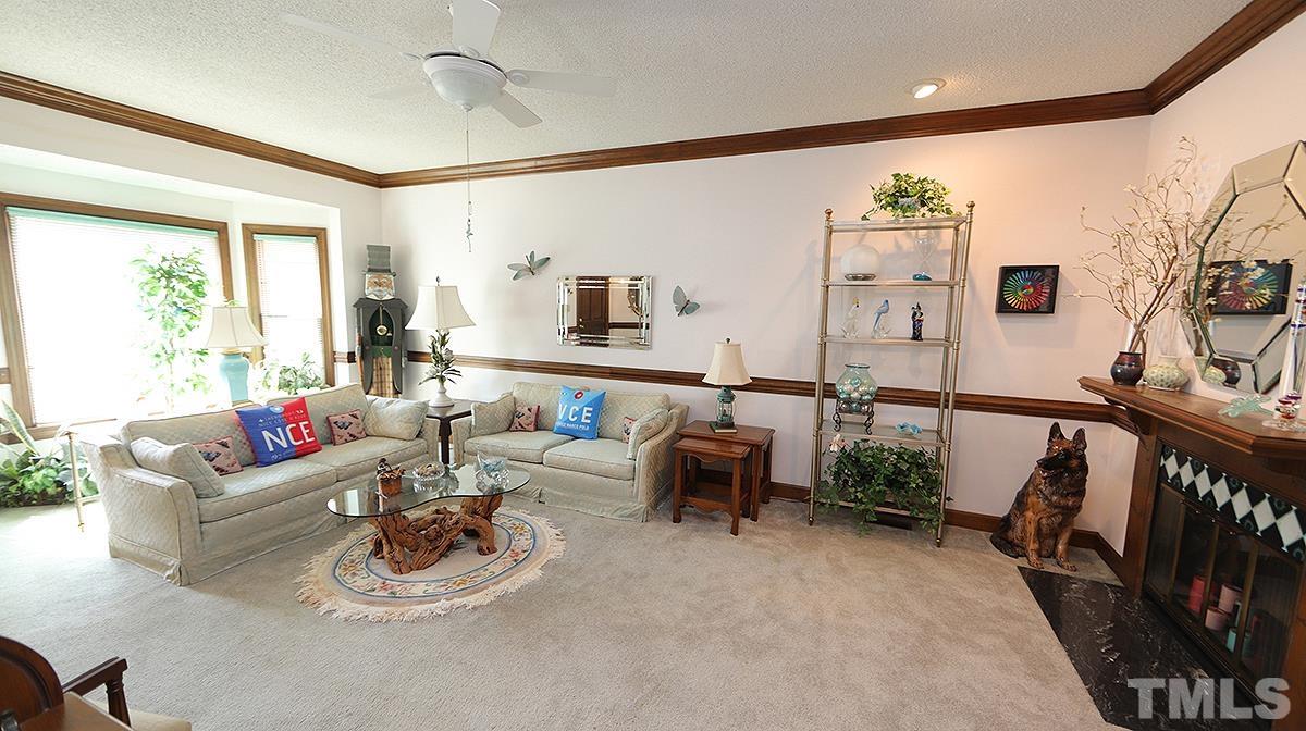 7943 Footman Way Raleigh, NC 27615 - Photo 3 of 11 a living room with furniture and wooden floor