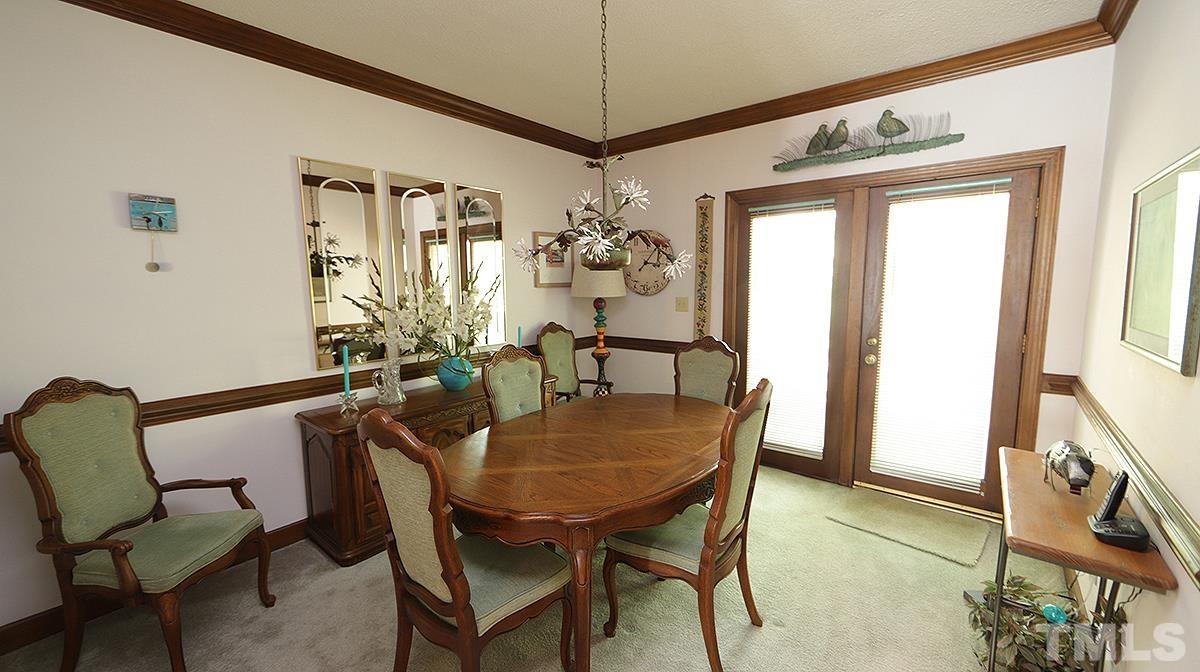 7943 Footman Way Raleigh, NC 27615 - Photo 4 of 11 a dining room with furniture and window
