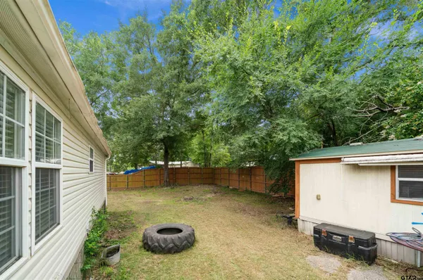 a backyard of a house with seating space