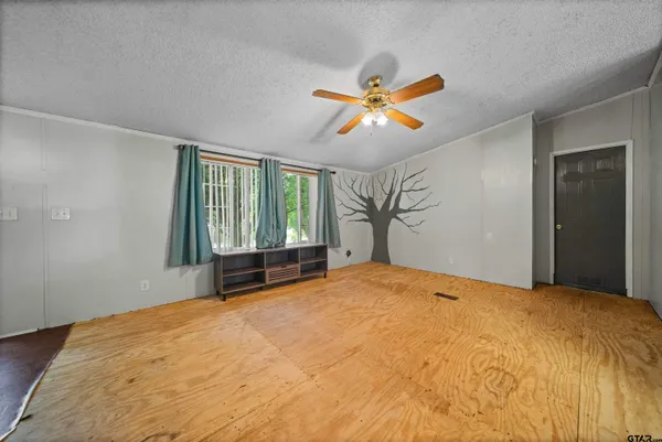 a kitchen with stainless steel appliances granite countertop wooden cabinets a sink and dishwasher a refrigerator with wooden floor