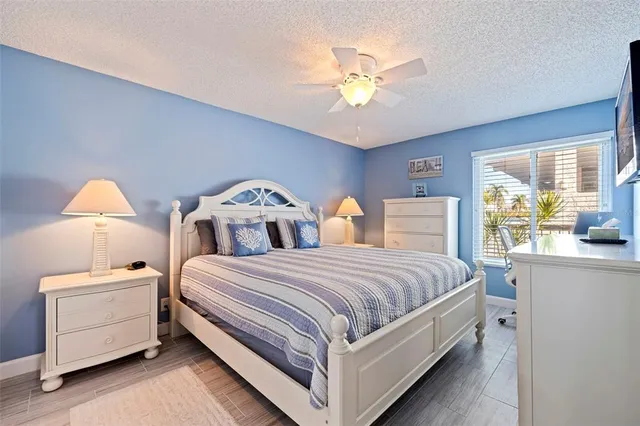 a bed room with two beds and a chandelier