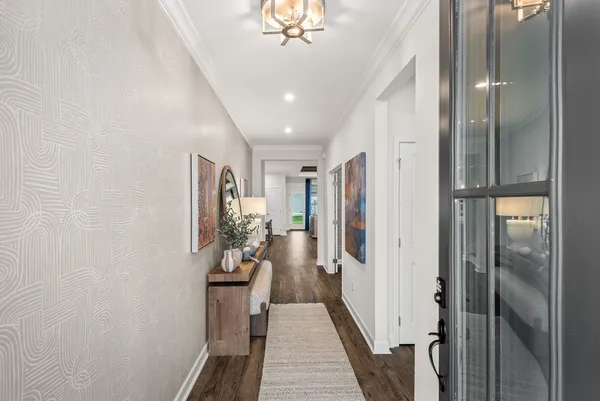 a view of a hallway with a chandelier