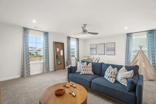a living room with furniture and a window