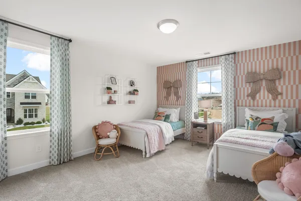 a spacious bedroom with a bed and a window