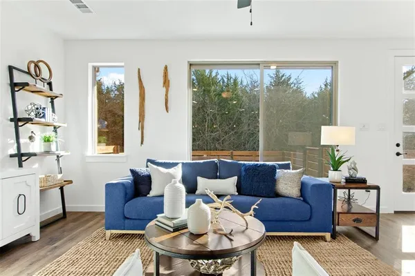 a living room with furniture and a large window