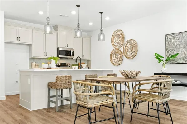 a kitchen with a table and chairs in it