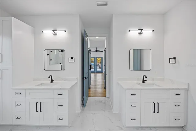 a bathroom with a sink and mirror