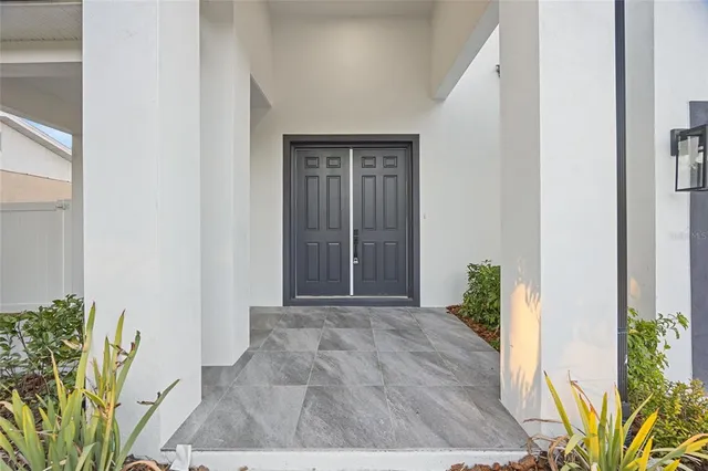 a view of an entryway with wooden floor