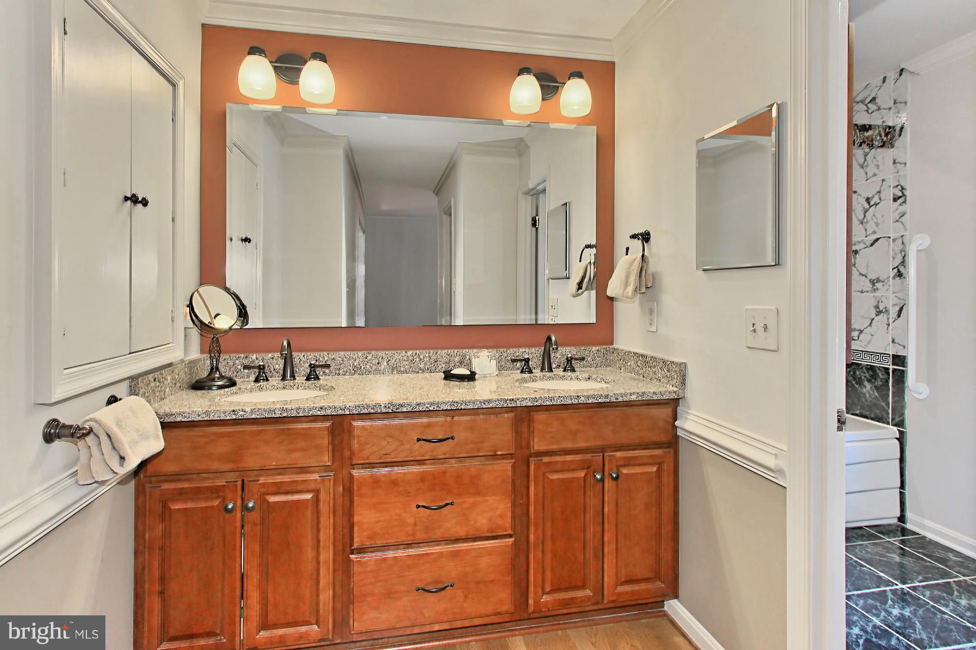 8305 Magic Leaf Road Springfield, VA 22153 - Photo 17 of 30 Two Part Master Bath has Cherry Vanity/Soaking Tub