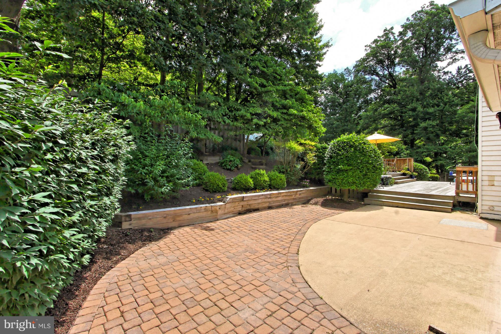 8305 Magic Leaf Road Springfield, VA 22153 - Photo 26 of 30 Brick Pavers and Concrete Patio Adjacent to Deck