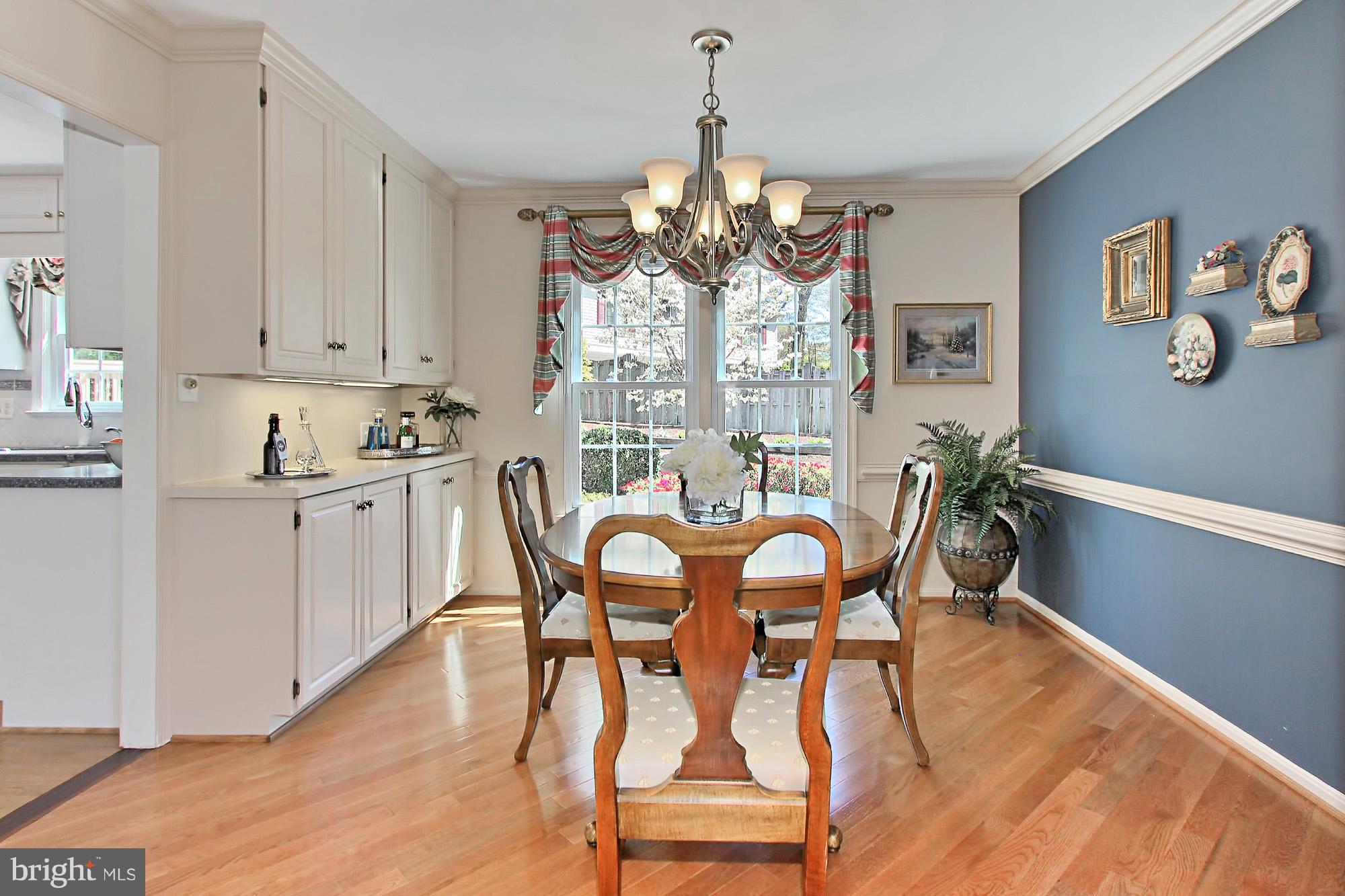 8305 Magic Leaf Road Springfield, VA 22153 - Photo 9 of 30 Dining Room has Chair Rail & Crown Molding.