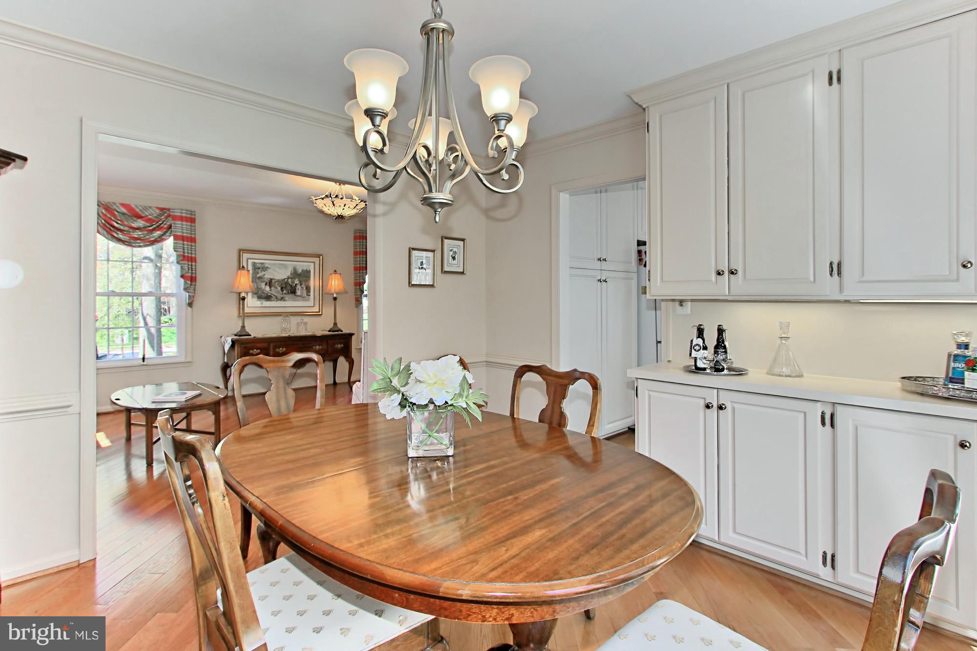 8305 Magic Leaf Road Springfield, VA 22153 - Photo 10 of 30 Dining Room with Custom Cabinetry & Lighting