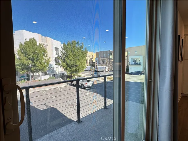 a view of a living room and a floor to ceiling window