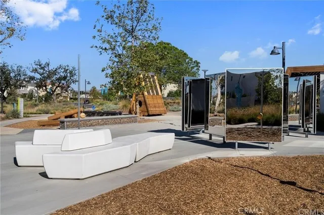 a swimming pool with outdoor seating and yard