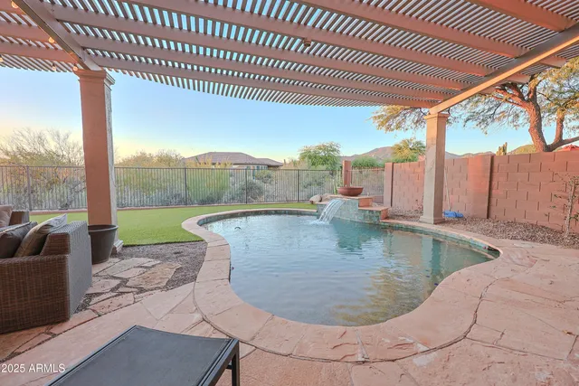 a view of a swimming pool with a patio