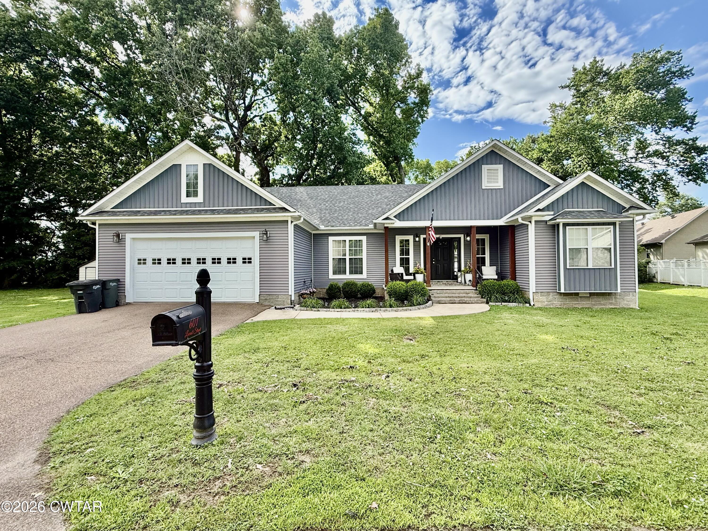 601 Locust Street Troy, TN 38260 - Photo 22 of 22 a front view of a house with a yard