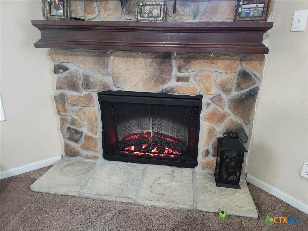 1845 Royal Road Port Lavaca, TX 77979 - Photo 3 of 22 a fireplace with a clock on top of it