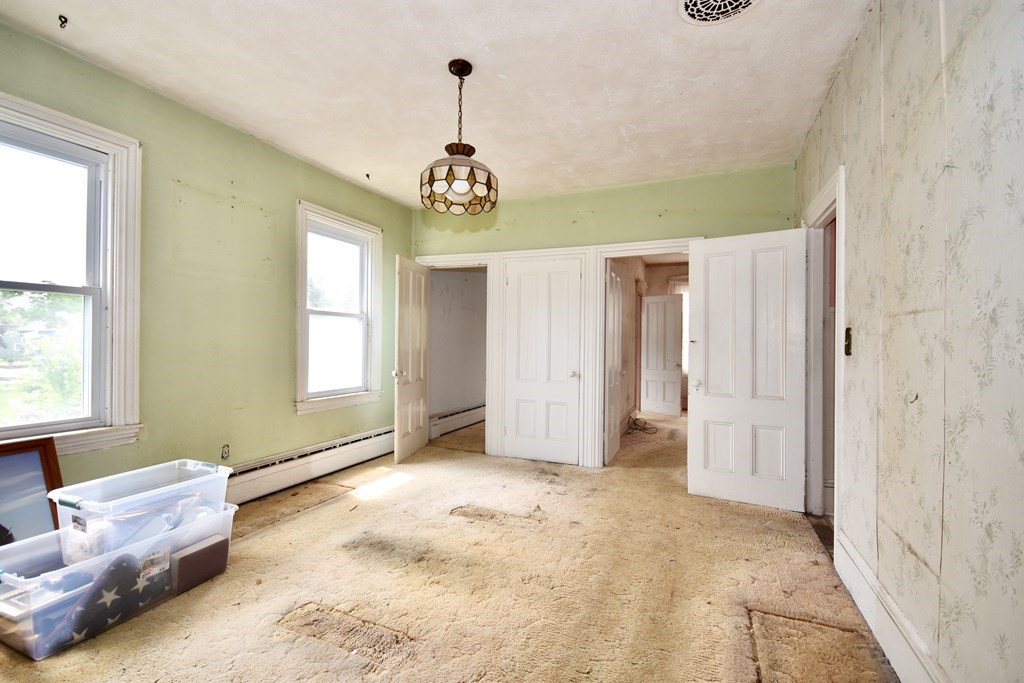 215 High Street Wareham, MA 02571 - Photo 13 of 19 a view of a livingroom with a chandelier furniture and windows