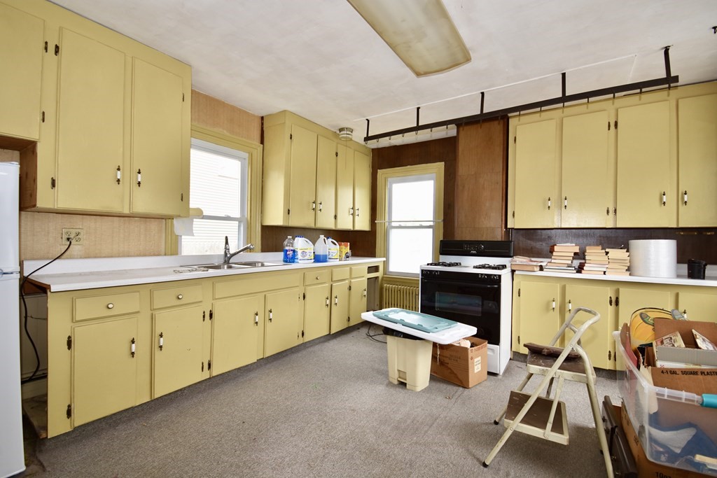 215 High Street Wareham, MA 02571 - Photo 15 of 19 a kitchen with sink cabinets and appliances