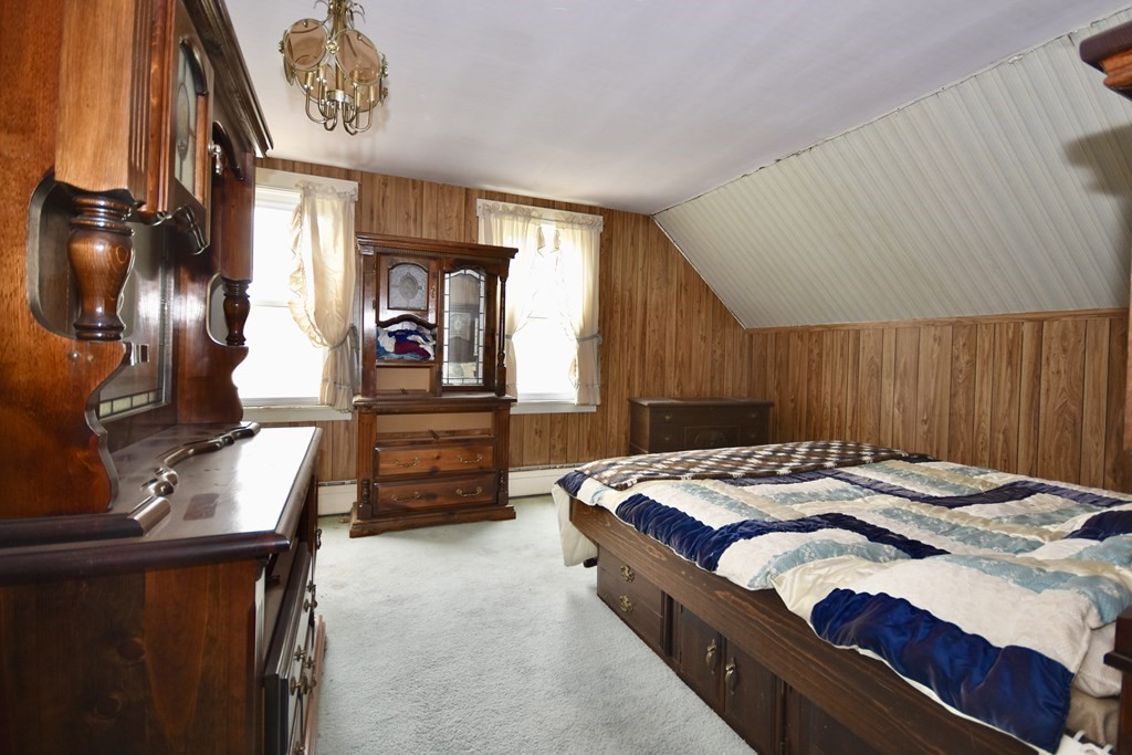 215 High Street Wareham, MA 02571 - Photo 17 of 19 a bed sitting in a room next to a window