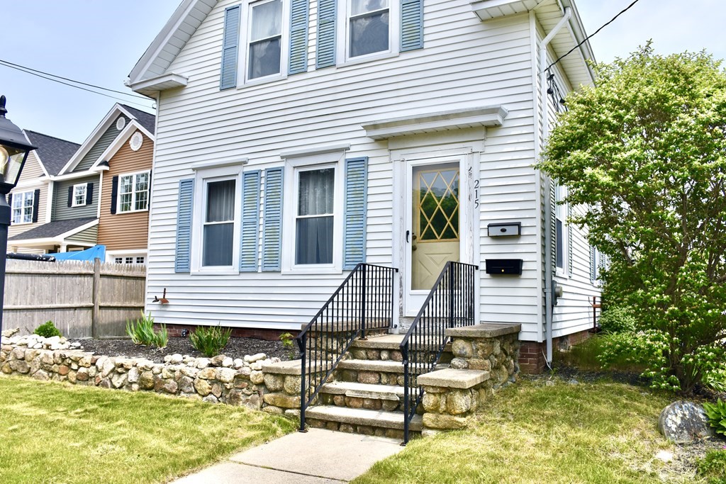 215 High Street Wareham, MA 02571 - Photo 2 of 19 a view of a house with wooden fence