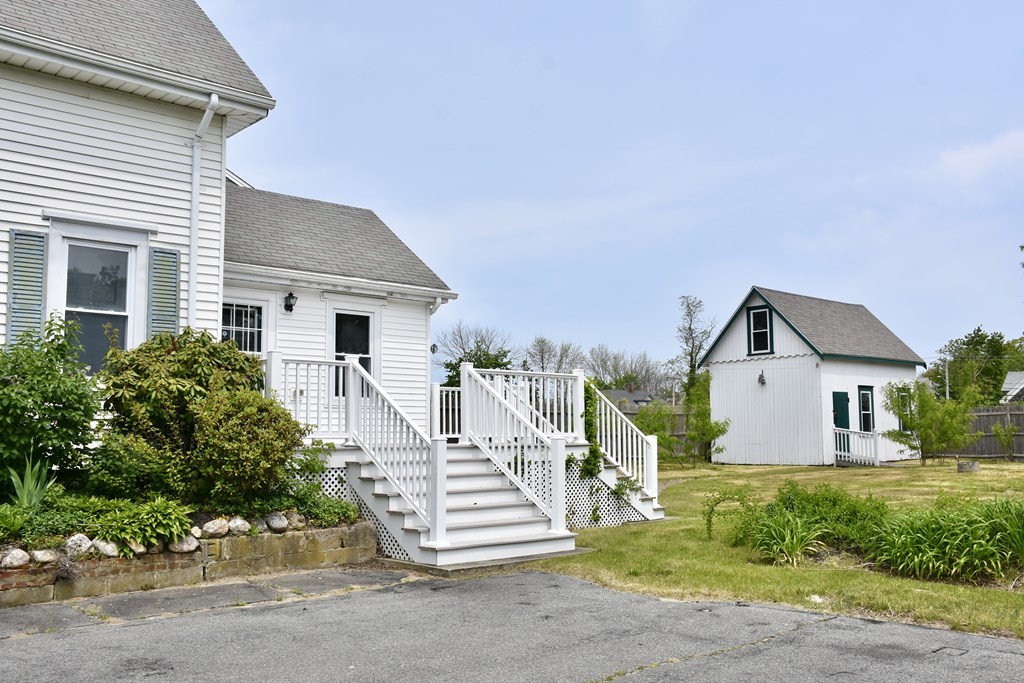 215 High Street Wareham, MA 02571 - Photo 3 of 19 front view of a house with a yard