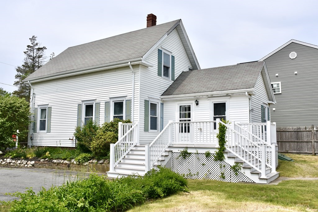 215 High Street Wareham, MA 02571 - Photo 4 of 19 a front view of a house with a yard