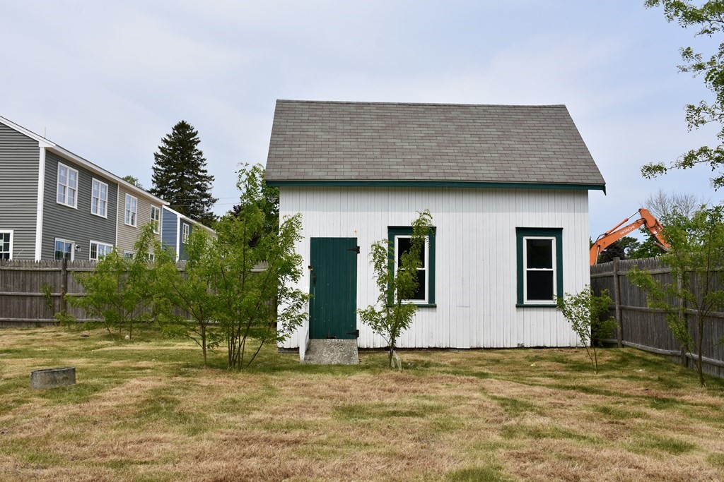 215 High Street Wareham, MA 02571 - Photo 7 of 19 a house that has a tree in front of it