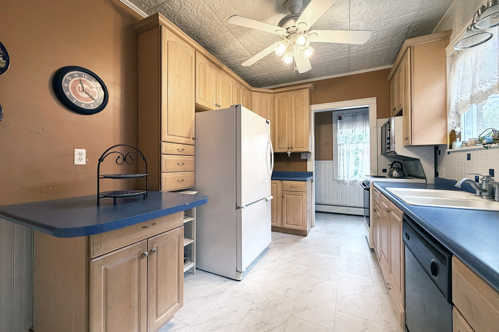 118 South William Street Mount Prospect, IL 60056 - Photo 12 of 24 a kitchen with granite countertop a sink appliances cabinets and furniture