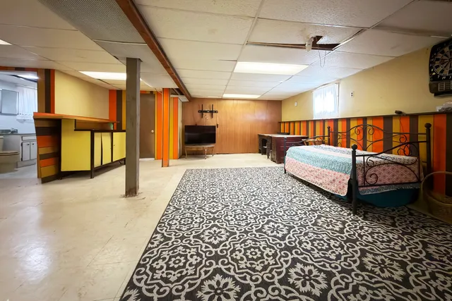 a bedroom with bed and window