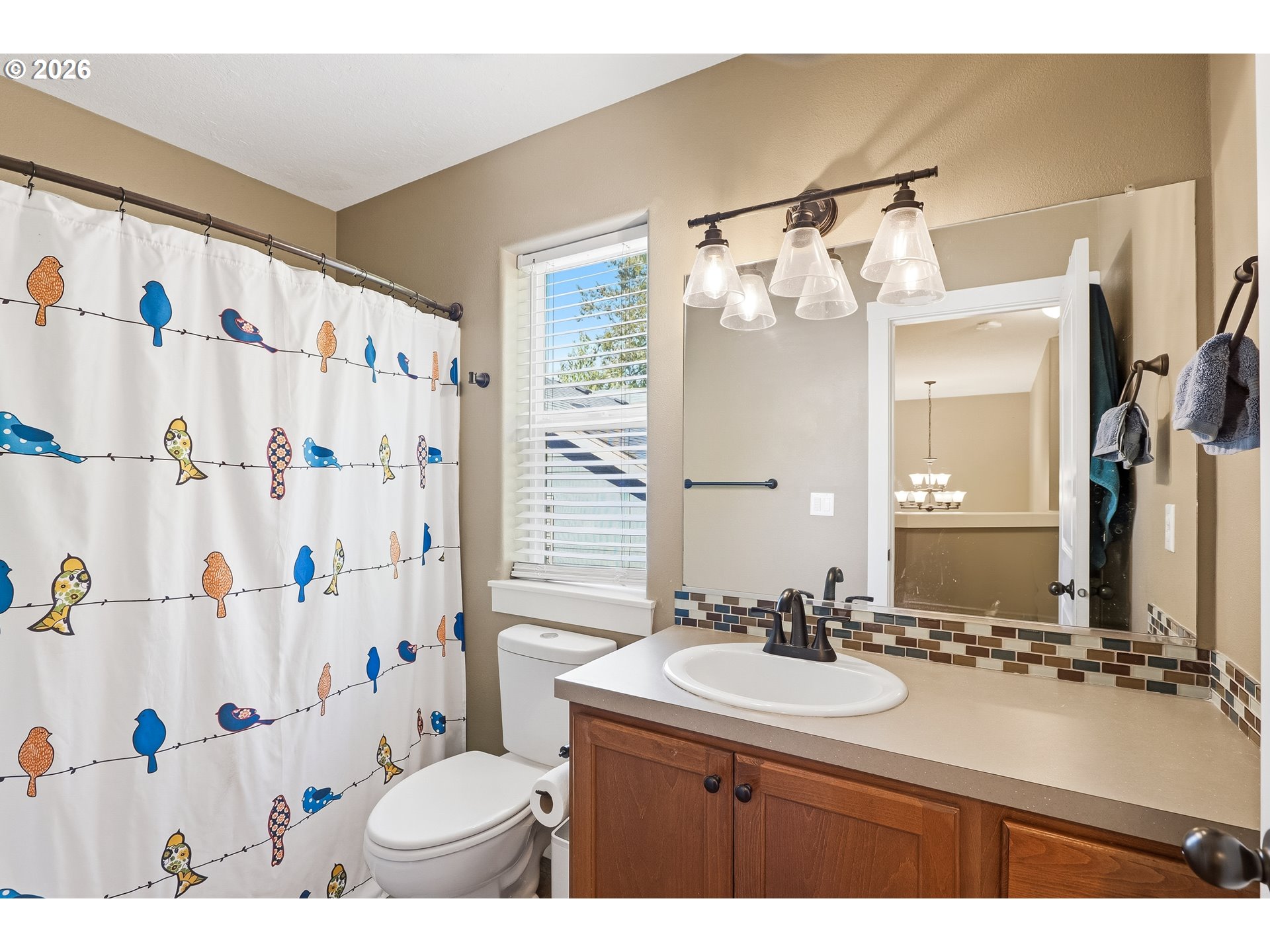 17376 Aubin Street Sandy, OR 97055 - Photo 14 of 21 a bathroom with a sink vanity mirror and toilet